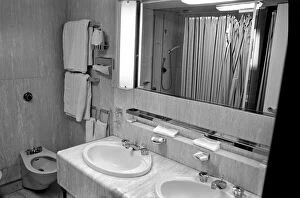 Interior view showing one of the cabin bathrooms aboard the luxury passenger liner QE2
