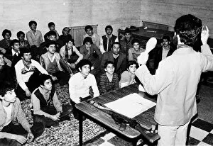 Iran boys and men being in instructed by military teacher. 1979