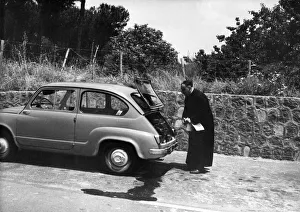 An Italian priest has trouble with his car on the Autostrada outside Naples An Italian priest has trouble with his car on the Autostrada outside Naples