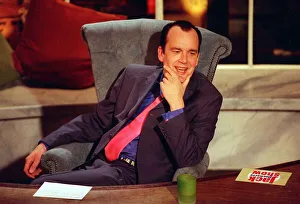 Jack Docherty sitting in chair next to desk in Channel 5 studio April 1997 Jack Docherty sitting in chair next to desk in Channel 5 studio April 1997