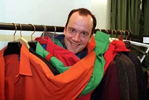 Images Dated 18th April 1997: Jack Docherty TV Presenter in between clothes rail full of coloured jackets