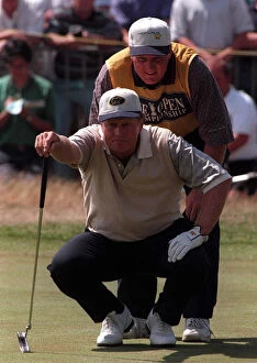Images Dated 19th July 1996: Jack Nicklaus Golfer measures up the line of play with his son Steve on the 18th green