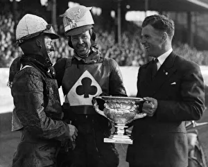 Jack Rowley of Manchester United presenting the cup to Speedway champion Jack Parker Jack Rowley of Manchester United presenting the cup to Speedway champion Jack Parker