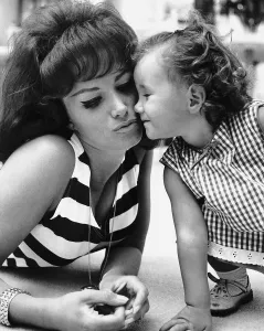 Jackie Collins Actress and Writer playing with her daughter Tracey Collins dbase Jackie Collins Actress and Writer playing with her daughter Tracey Collins dbase