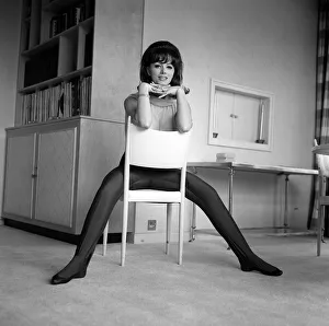 Jackie Collins authoress sitting astride a chair at home Mar 1964 Jackie Collins authoress sitting astride a chair at home Mar 1964