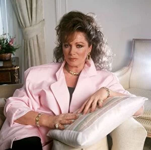 Jackie Collins sitting in chair - May 1988 Dbase MSI