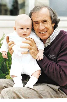 Jackie Stewart holding his grandson Dylan Stewart July 1995 Jackie Stewart holding his grandson Dylan Stewart July 1995