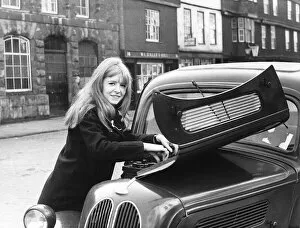 Occupation M Gallery: Jane Asher actress looking under car bonnet