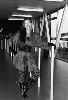 Images Dated 22nd September 1987: Jane Seymouractress arriving at Heathrow airport leaning on rail