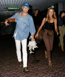 Jason Donovan actor and singer with girlfriend Tara Owens as they returned to Britain Jason Donovan actor and singer with girlfriend Tara Owens as they returned to Britain