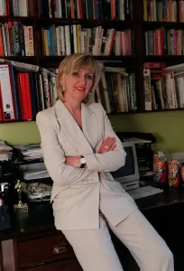 Images Dated 22nd May 1998: Jayne Irving TV Presenter July 1998 At home sitting on her desk A©mirrorpix