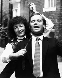 Images Dated 3rd October 1985: Jeffrey Archer MP elected tie man of the year and author with tv presenter Judith Hann