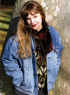 Jennifer Calvert Actress Standing against a tree. Wearing a denim jacket Jennifer Calvert Actress Standing against a tree. Wearing a denim jacket
