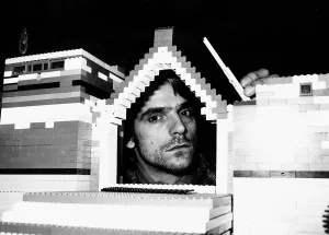 Jeremy Irons Actor with his head inside model house built from lego bricks which was used Jeremy Irons Actor with his head inside model house built from lego bricks which was used