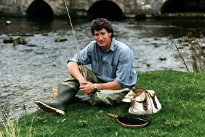 Images Dated 26th April 1996: Jeremy Paxman tv presenter of Newsnight and journalist with his fishing gear on riverbank