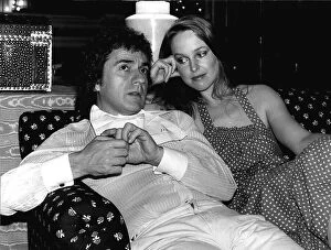 Images Dated 18th July 1980: Jill Eikenberry sitting on a sofa with Dudley Moore actor and musician dbase