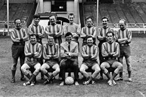 Jimmy Hill pictured (wearing a suit) with a football team Jimmy Hill pictured (wearing a suit) with a football team