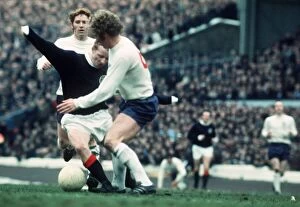 Jimmy Johnstone of Scotland battles for control of the ball with Alan Ball of England