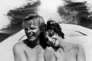 Joan Collins actress and her fiancee Peter Holm cuddle up together on a boat trip during Joan Collins actress and her fiancee Peter Holm cuddle up together on a boat trip during