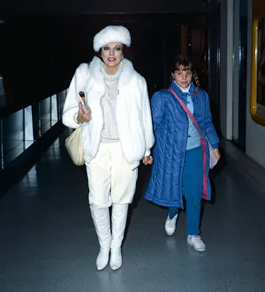 Joan Collins actress leaves Heathrow Airport with daughter Katy, holding hands Joan Collins actress leaves Heathrow Airport with daughter Katy, holding hands