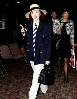 Images Dated 28th April 1992: Joan Collins Actress Walking throuh Airport holding black bag