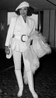 Boots And Shoes Gallery: Joan Collins British actress arriving at Heathrow from Los Angeles in January 1988
