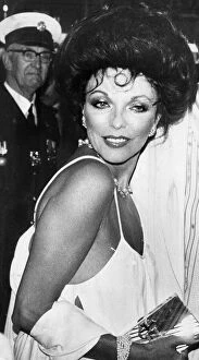 Joan Collins Gallery: Joan Collins at premiere of The Stud wearing low cut evening gown - April 1978