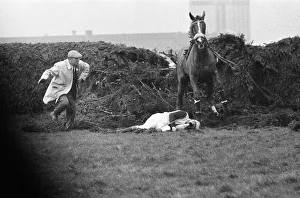 Grand National Gallery: Jockey Paddy Farrell is thrown from his horse Border Flight at the 15th fence of