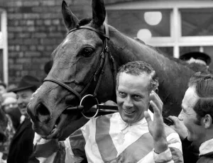 Grand National Gallery: Jockey Pat Taaffe smiles and waves with his horse Gay Trip in the winners enclosure