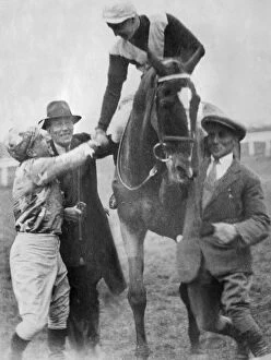 Grand National Gallery: Jockey Tommy Cullinan is congratulated after winning the 1930 Grand National