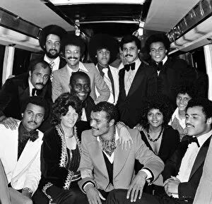 Images Dated 1st October 1974: John Conteh celebrates with family aboard a playboy motor coach after winning world title