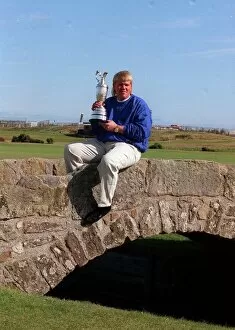 Images Dated 24th July 1995: John Daly golfer Open Champion 1995 with trophy sitting on stone bridge