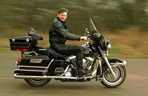 Images Dated 5th March 1997: John Gordon Sinclair actor riding his Harley Davidson Electra Glide motorcycle