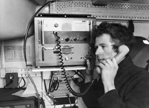 John Hart receives a message on the ship to shore lifeboat radio in Barry, Wales John Hart receives a message on the ship to shore lifeboat radio in Barry, Wales