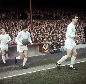 Johnny Aston leads Manchester United team mates George Best & Bobby Charlton onto Johnny Aston leads Manchester United team mates George Best & Bobby Charlton onto