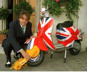Jonathan Ross TV Presenter has his scooter clamped outside virgin radio this morning by Jonathan Ross TV Presenter has his scooter clamped outside virgin radio this morning by