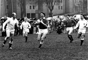 JPR Williams of the Old Wales team makes a break for the Old England Line during their JPR Williams of the Old Wales team makes a break for the Old England Line during their