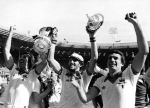Jubilant West Ham players Billy Bonds, David Cross and Trevor Brooking celebrate their Jubilant West Ham players Billy Bonds, David Cross and Trevor Brooking celebrate their