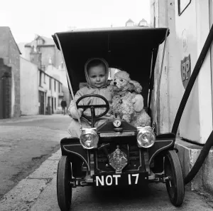 Judy Oliver in her vintage baby car. 1st March 1964 Judy Oliver in her vintage baby car. 1st March 1964