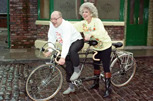 Julie Goodyear and Roy Barraclough pictured on a tandem bike on the set of Coronation Julie Goodyear and Roy Barraclough pictured on a tandem bike on the set of Coronation