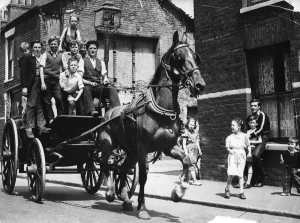 June 1957. Children riding on a cart drawn by a horse which was owned by Griffin June 1957. Children riding on a cart drawn by a horse which was owned by Griffin