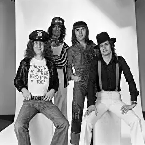 Images Dated 4th December 1975: Just home in time for Christmas in England - Slade have a new record going into