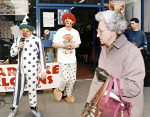 Images Dated 15th March 1995: Karaoke clowns Peter Watson (right) and Stephen Brooks entertain shoppers in Stockton