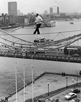 Karl Wallenda successfully walks 100 feet above the ground near Tower Bridge Karl Wallenda successfully walks 100 feet above the ground near Tower Bridge