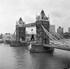 Karl Wallenda, Tightrope Walker, crosses 100ft above the ground, near Tower Bridge Karl Wallenda, Tightrope Walker, crosses 100ft above the ground, near Tower Bridge
