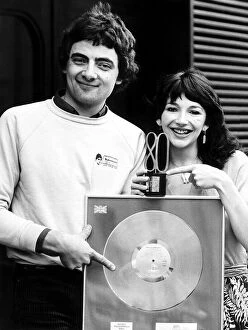 Images Dated 1st October 1980: Kate Bush with Rowan Atkinson at NME awards October 1980