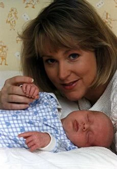Images Dated 2nd December 1995: Kathryn Holloway TV Presenter of UK Livings Agony Programme with baby son James Holloway