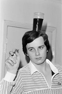 Keith Deller, World Darts Champion, balancing a pint on his head at The Rising Sun Keith Deller, World Darts Champion, balancing a pint on his head at The Rising Sun