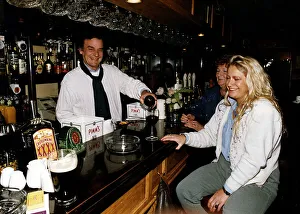 Keith Floyd Television Chef serving drinks from behind the bar at The Maltsters Arms near Keith Floyd Television Chef serving drinks from behind the bar at The Maltsters Arms near