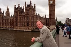 Images Dated 25th June 1998: Ken Livingstone MP standing on Westminster Bridge outside the Houses of Parliament